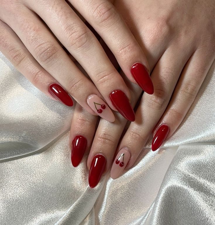 Glossy Red Nails with Cherry Accents